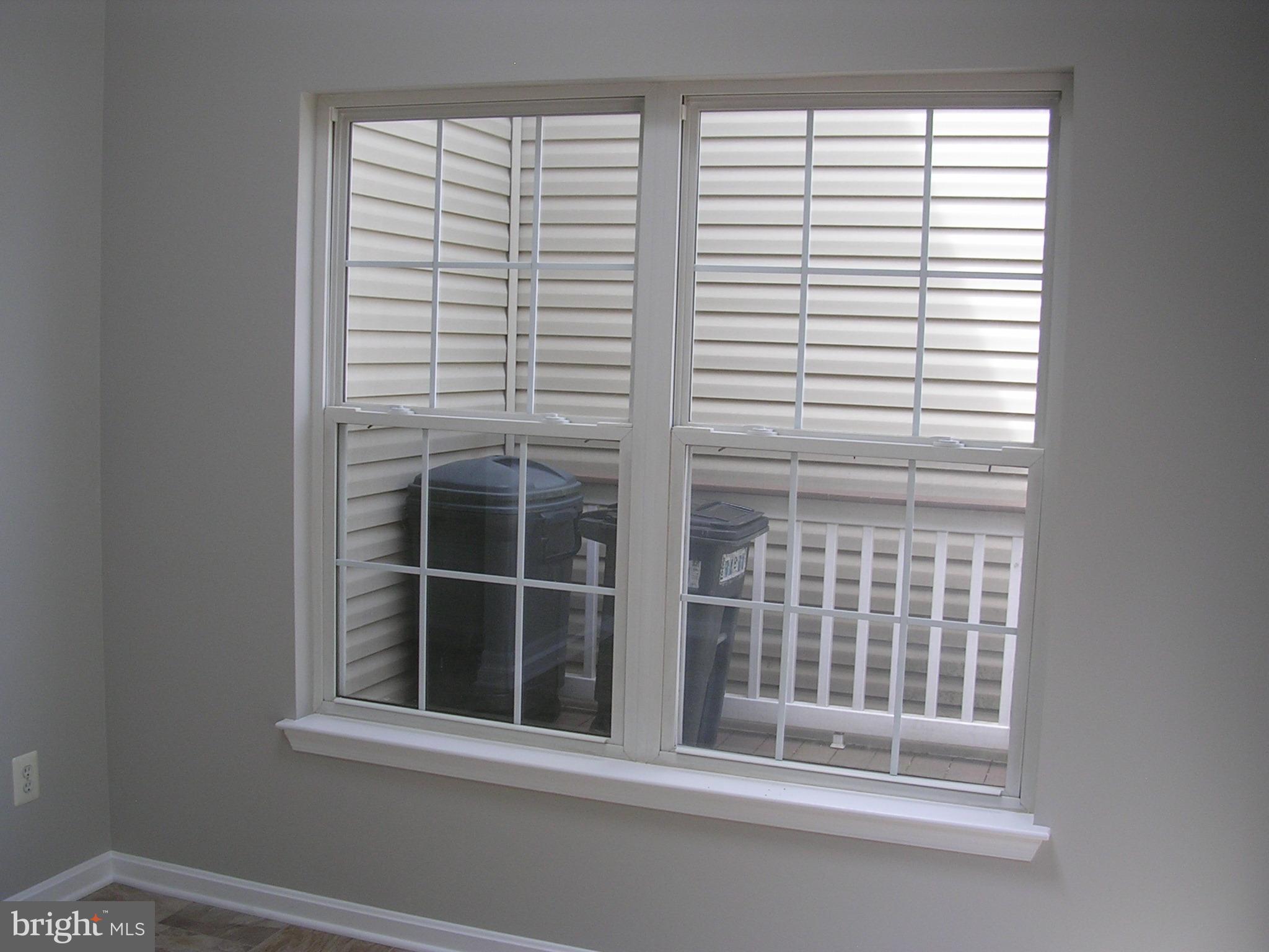 32 Bellhurst Way Nottingham, MD 21236 - Photo 11 of 28 windows in sunroom overlook L shaped deck