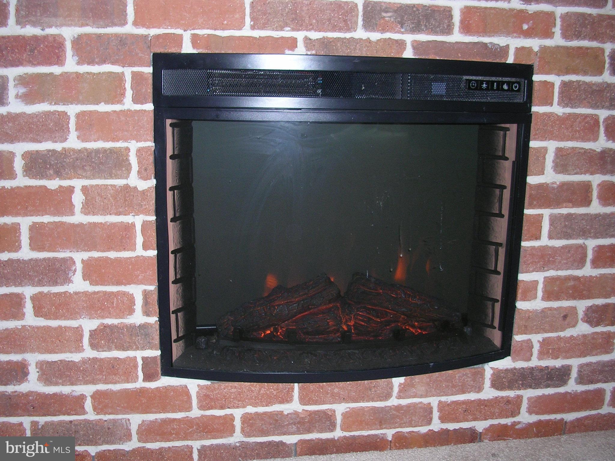 32 Bellhurst Way Nottingham, MD 21236 - Photo 20 of 28 lower level electric fireplace