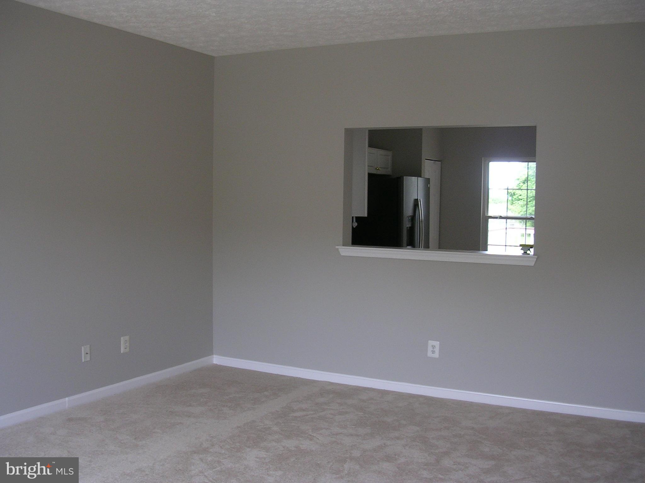 32 Bellhurst Way Nottingham, MD 21236 - Photo 6 of 28 living room toward kitchen pass through