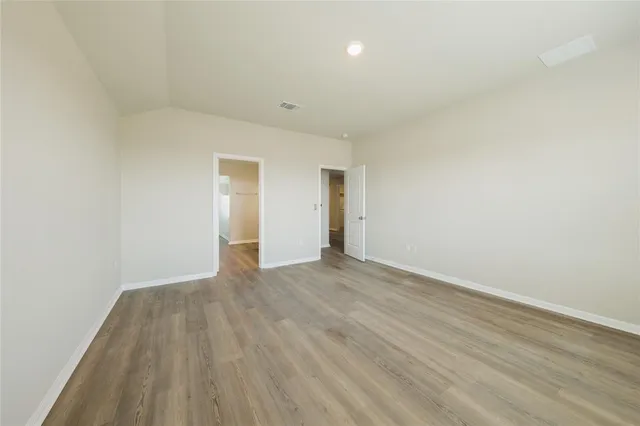 a view of workspace with wooden floor windows