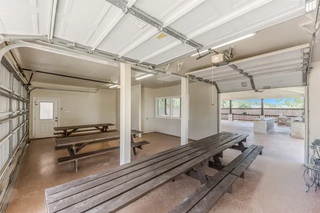 a gym room with wooden floor and furniture