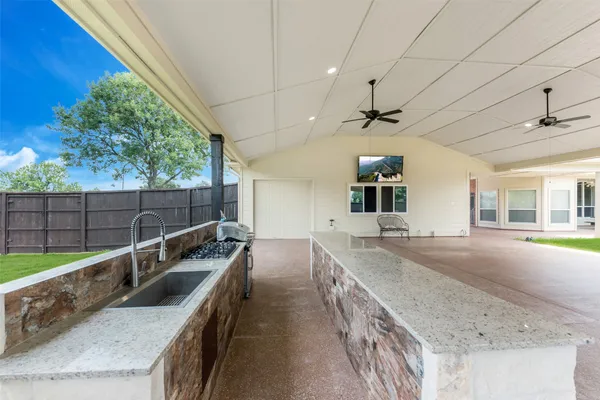 a view of a kitchen with a sink and dishwasher