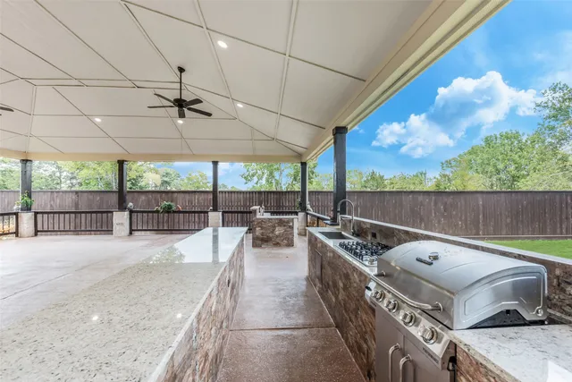 a roof deck with table and chairs