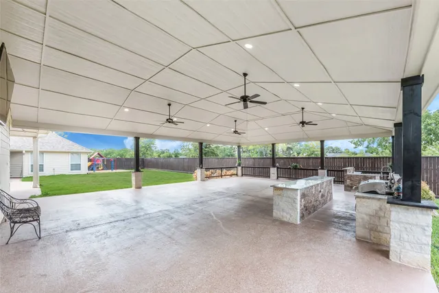 a view of a patio with couches and chairs
