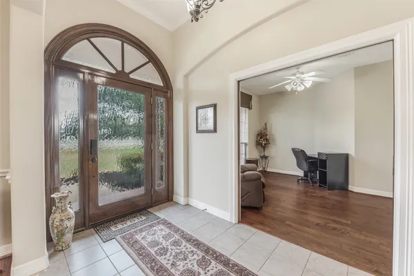 a view of a hallway view with furniture and front door