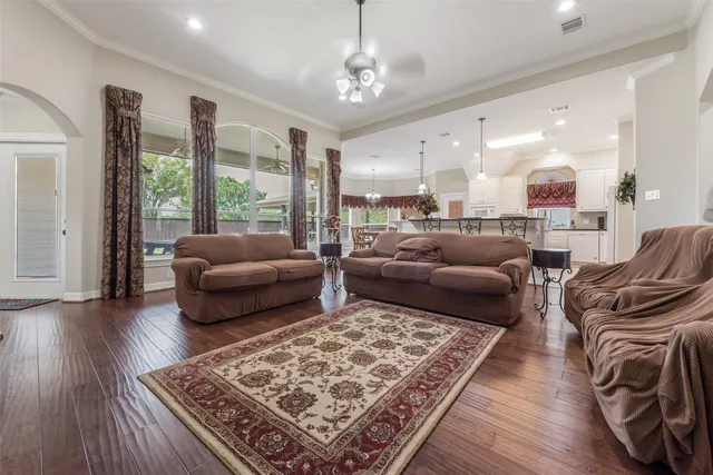 a living room with furniture rug and a table