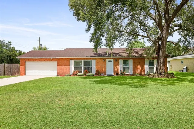 front view of a house with a garden