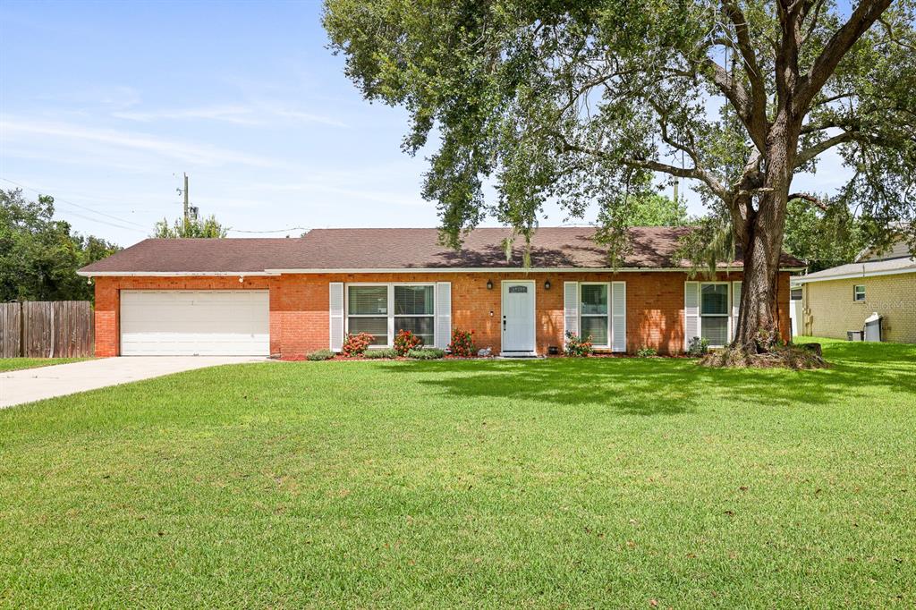 front view of a house with a garden