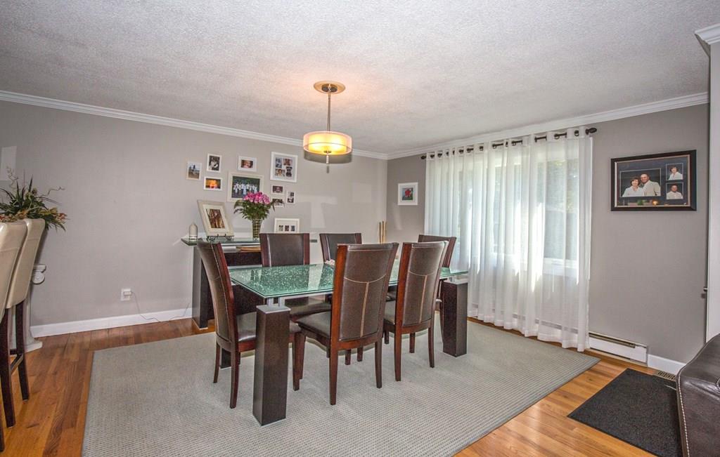 44 Quentin Road Springfield, MA 01129 - Photo 11 of 40 a view of a dining room with furniture and a window