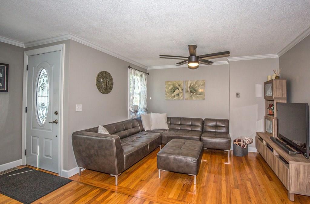 44 Quentin Road Springfield, MA 01129 - Photo 14 of 40 a living room with furniture and a flat screen tv