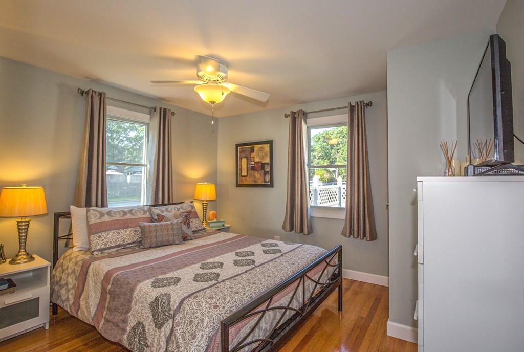 44 Quentin Road Springfield, MA 01129 - Photo 15 of 40 a bedroom with a bed a mirror on dresser and a window