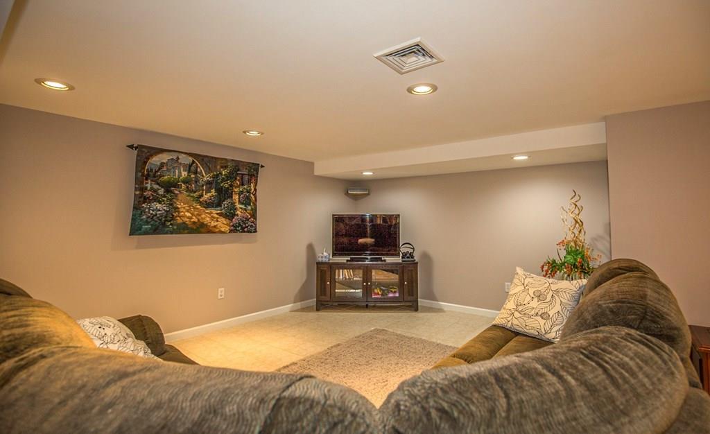 44 Quentin Road Springfield, MA 01129 - Photo 24 of 40 a bedroom with a bed and a couch