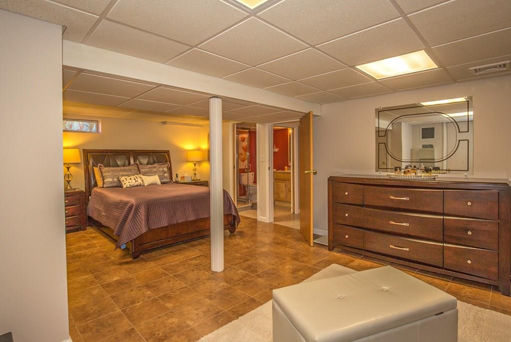 44 Quentin Road Springfield, MA 01129 - Photo 25 of 40 a bedroom with a large bed and a dresser