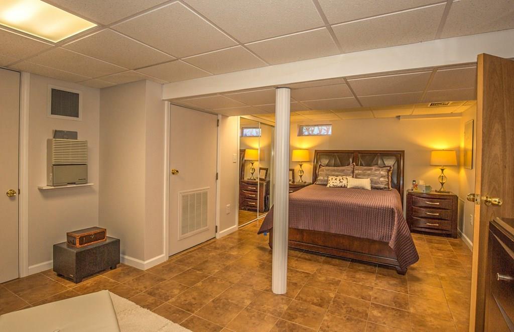 44 Quentin Road Springfield, MA 01129 - Photo 26 of 40 a bedroom with a bed and wooden floor