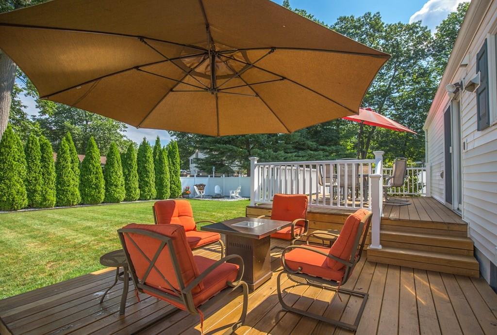 44 Quentin Road Springfield, MA 01129 - Photo 37 of 40 an outdoor sitting area with furniture and umbrella