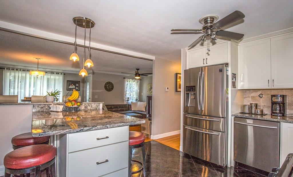 44 Quentin Road Springfield, MA 01129 - Photo 8 of 40 a kitchen with a refrigerator a sink and cabinets