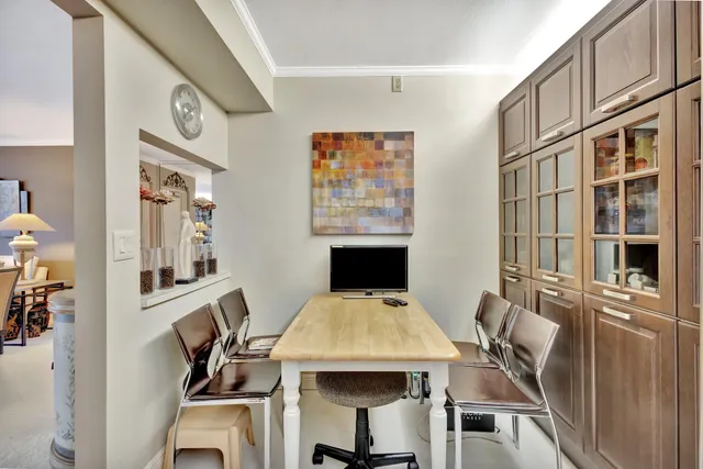 a kitchen with stainless steel appliances granite countertop a refrigerator a stove and a sink