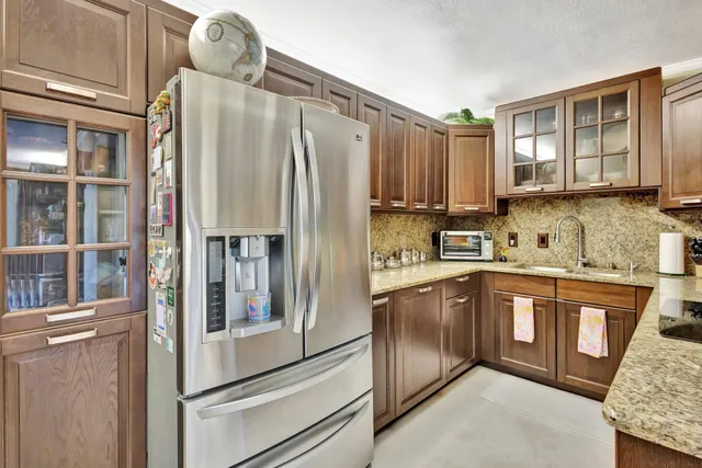 a kitchen with sink cabinets and microwave