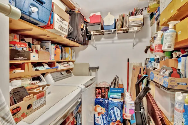 an aerial view of a house with a garden and trees