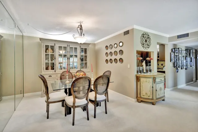 a kitchen with a refrigerator and a counter top space