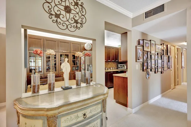 a dining room with furniture and chandelier