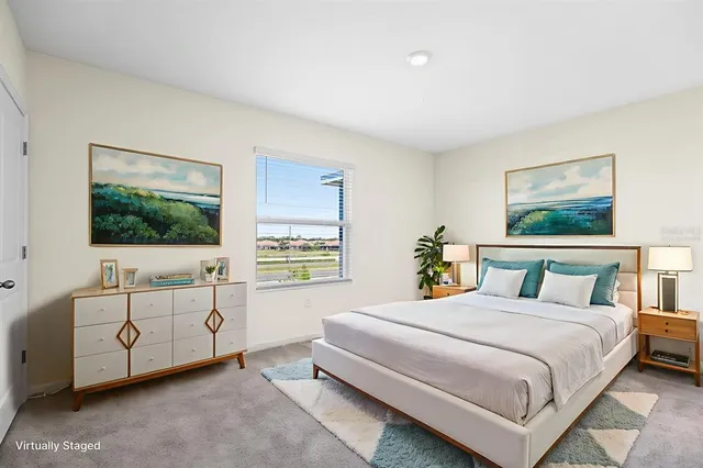 a bedroom with two beds and a flat screen tv