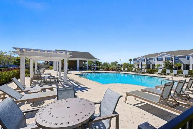 a view of a swimming pool with a patio