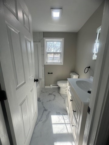15-17 Otis Court, Unit 15 Springfield, MA 01119 - Photo 13 of 16 a bathroom with a sink a toilet and a shower