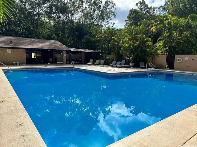 a view of a swimming pool with a patio