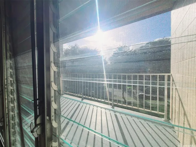 a view of balcony with wooden floor