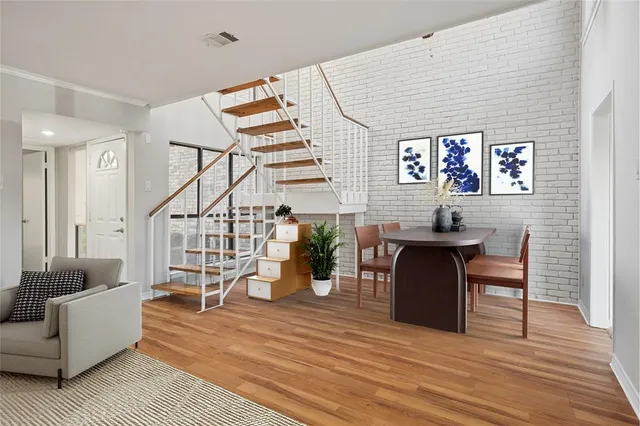 a view of a livingroom with furniture and wooden floor