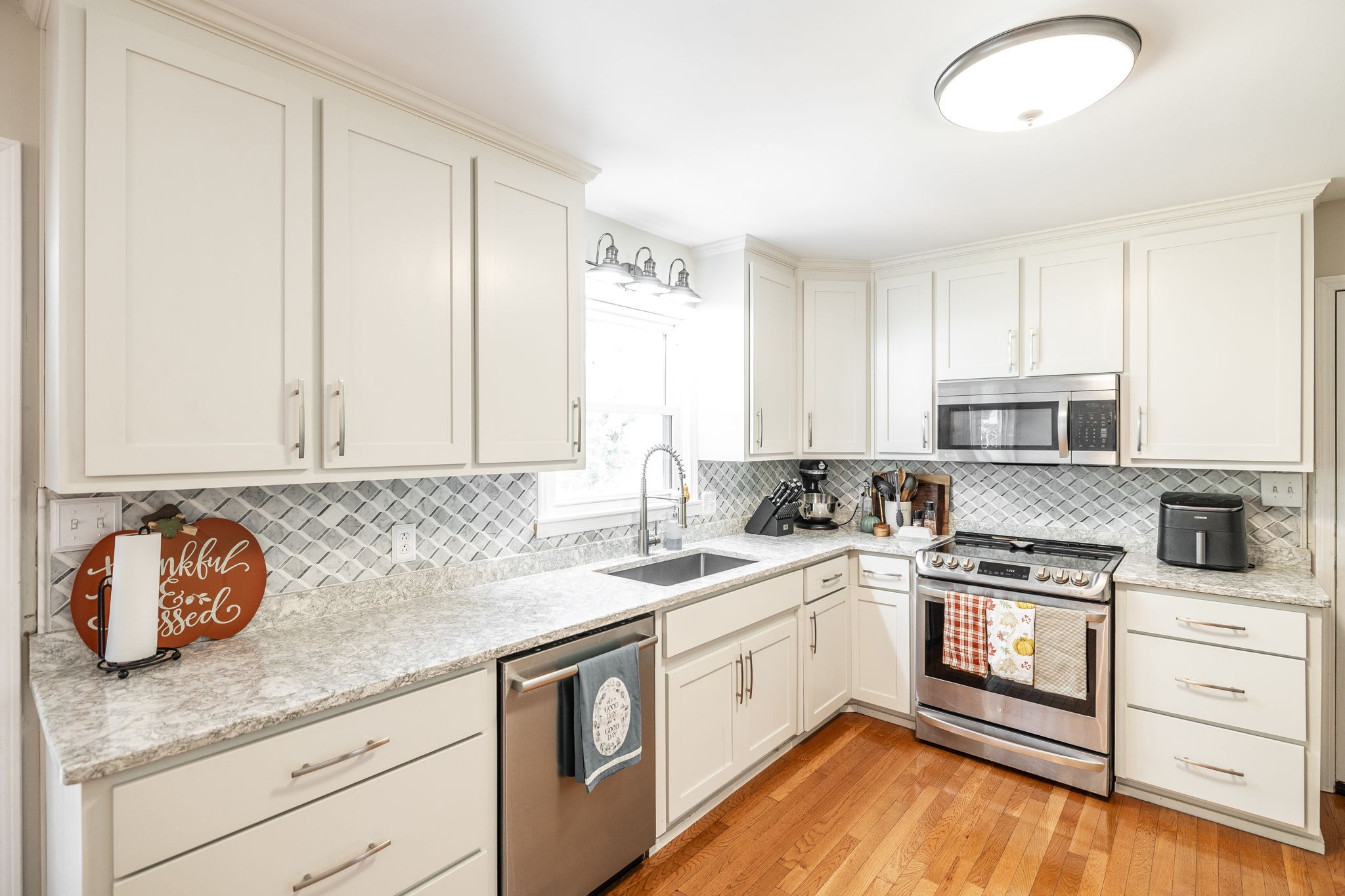 2714 Morgan Road Joelton, TN 37080 - Photo 13 of 78 a kitchen with a sink stove and cabinets