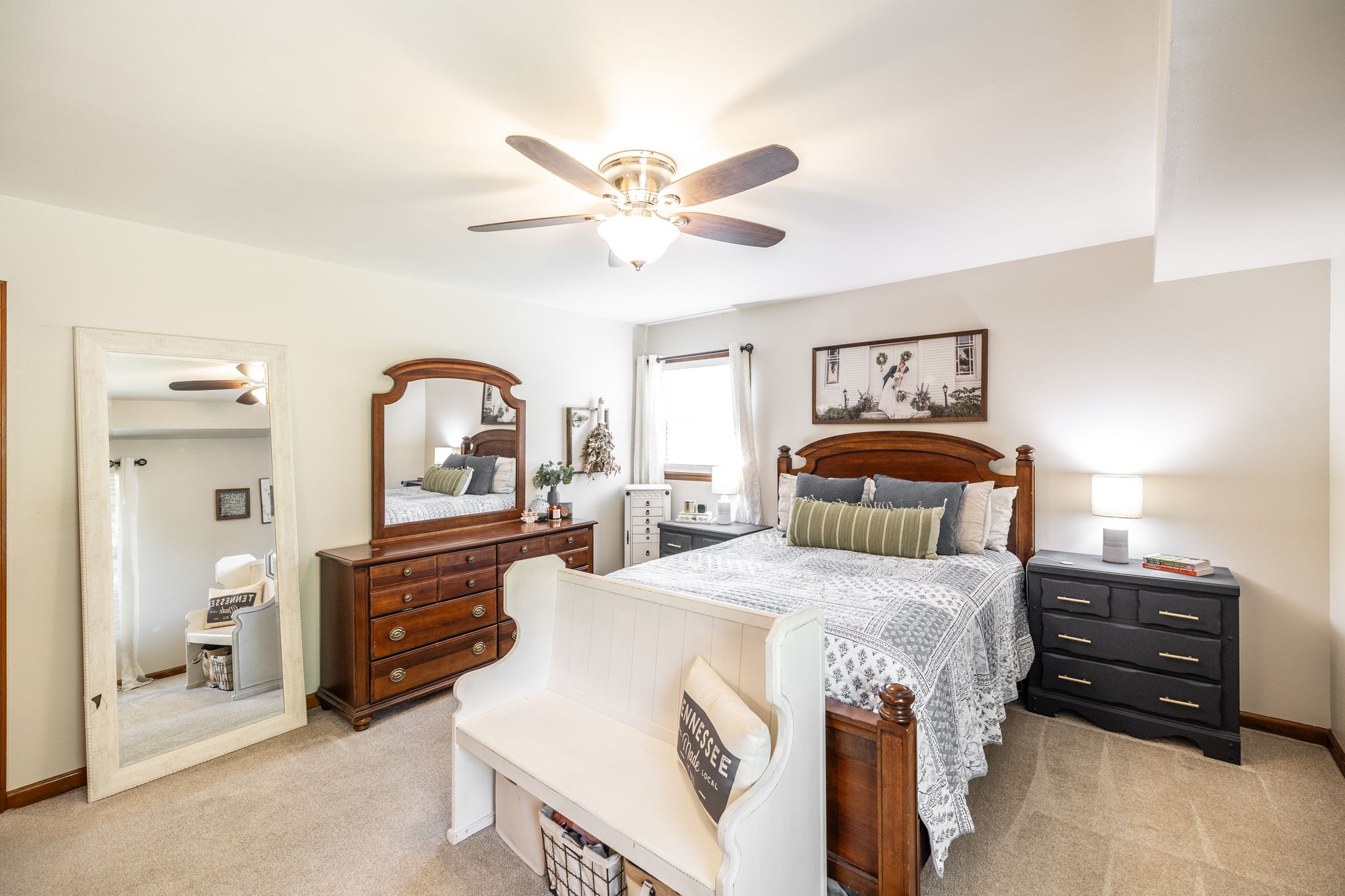 2714 Morgan Road Joelton, TN 37080 - Photo 48 of 78 a bedroom with a bed and a chandelier