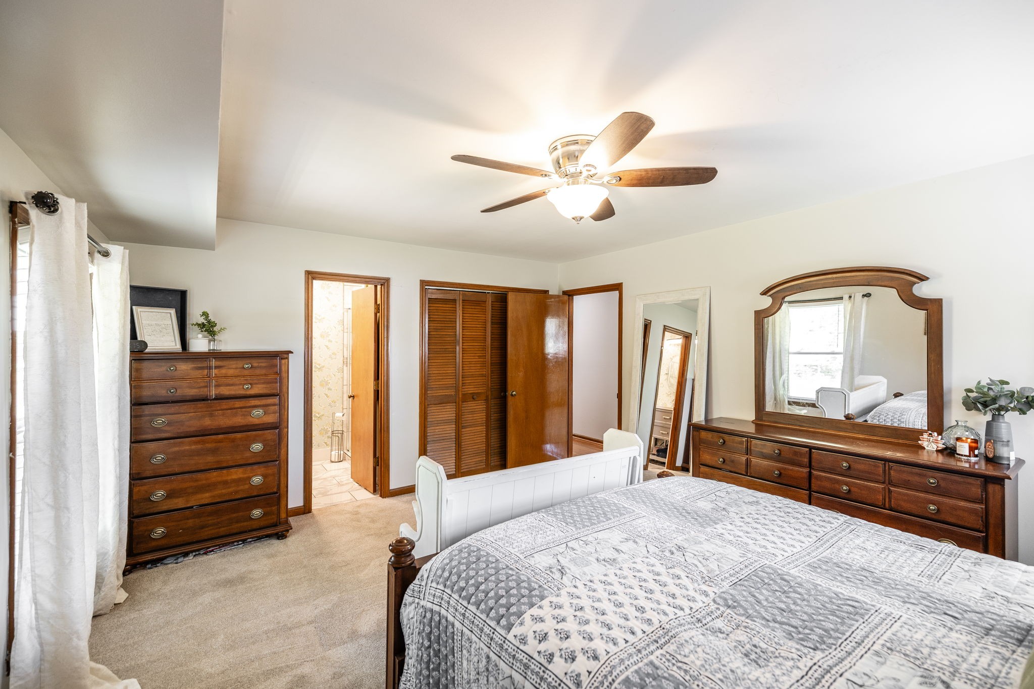 2714 Morgan Road Joelton, TN 37080 - Photo 49 of 78 a bedroom with a bed dresser and a large mirror