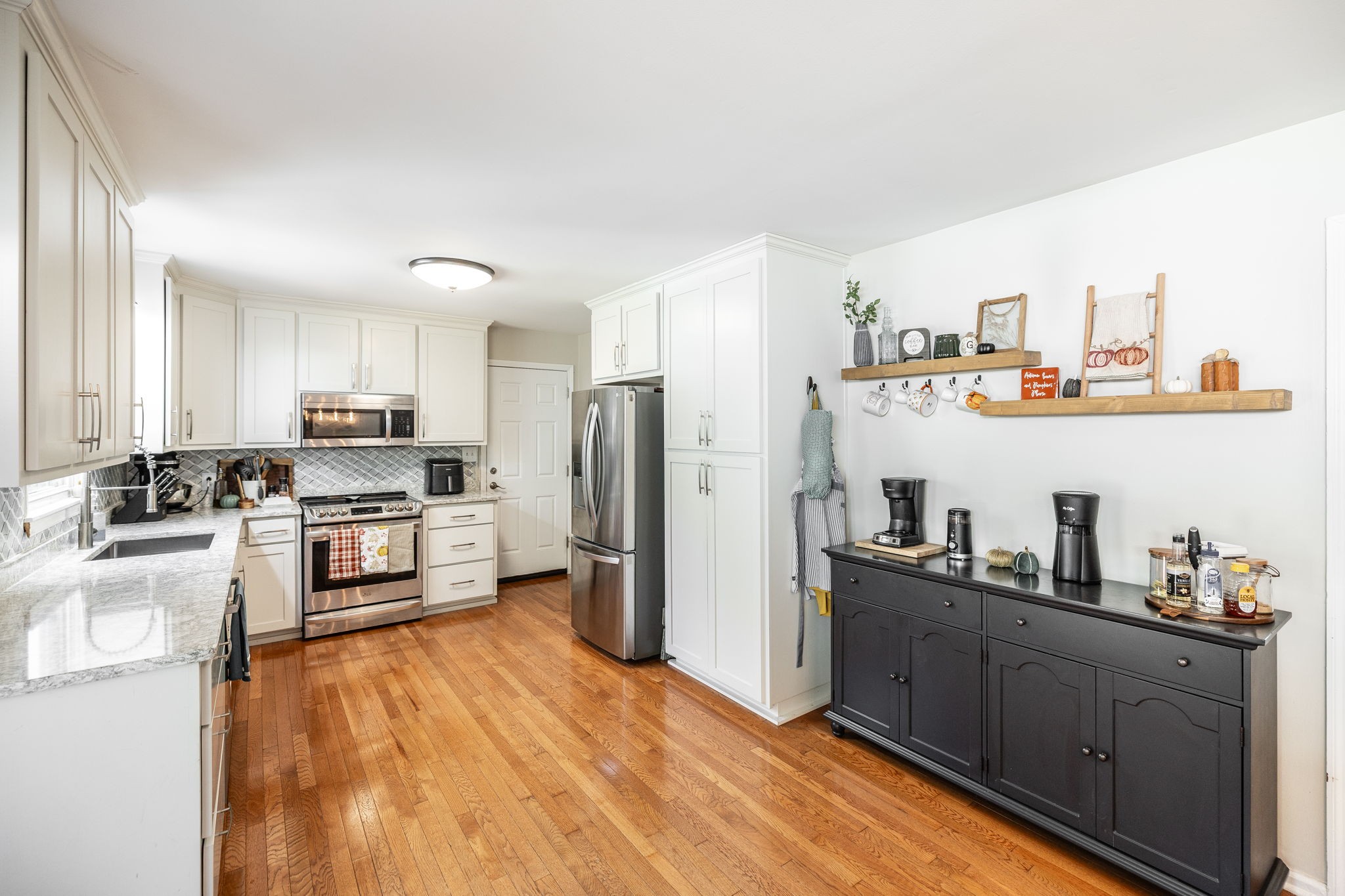 2714 Morgan Road Joelton, TN 37080 - Photo 9 of 78 a kitchen with stainless steel appliances a refrigerator and a stove top oven