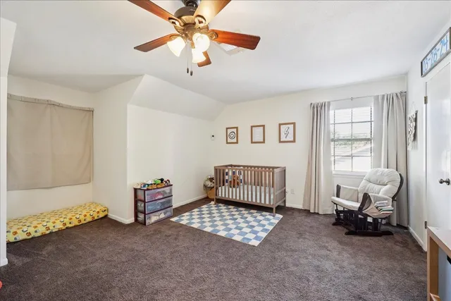 a bedroom with furniture and a window