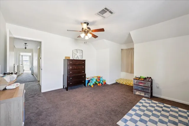 a bedroom with furniture and a chandelier