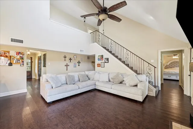 a living room with furniture and white walls