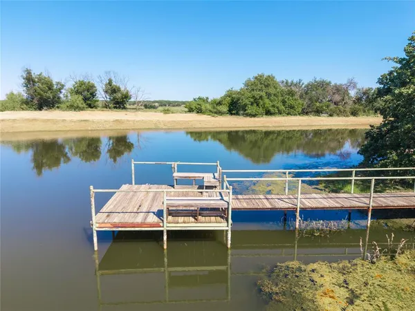 a bathroom with a sink vanity mirror and toilet