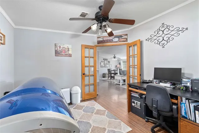 a bedroom with furniture and a wooden floor