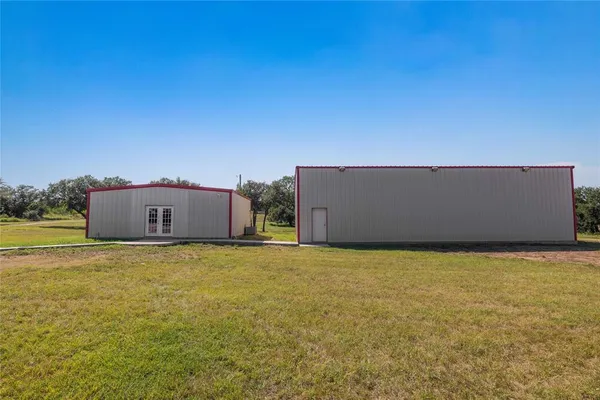 a view of a road with a big yard