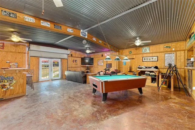 a room with lots of furniture and a chandelier