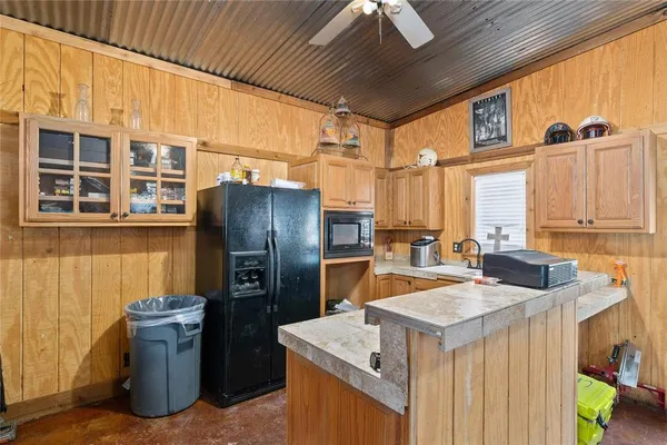 a view of a chairs and tables in the patio