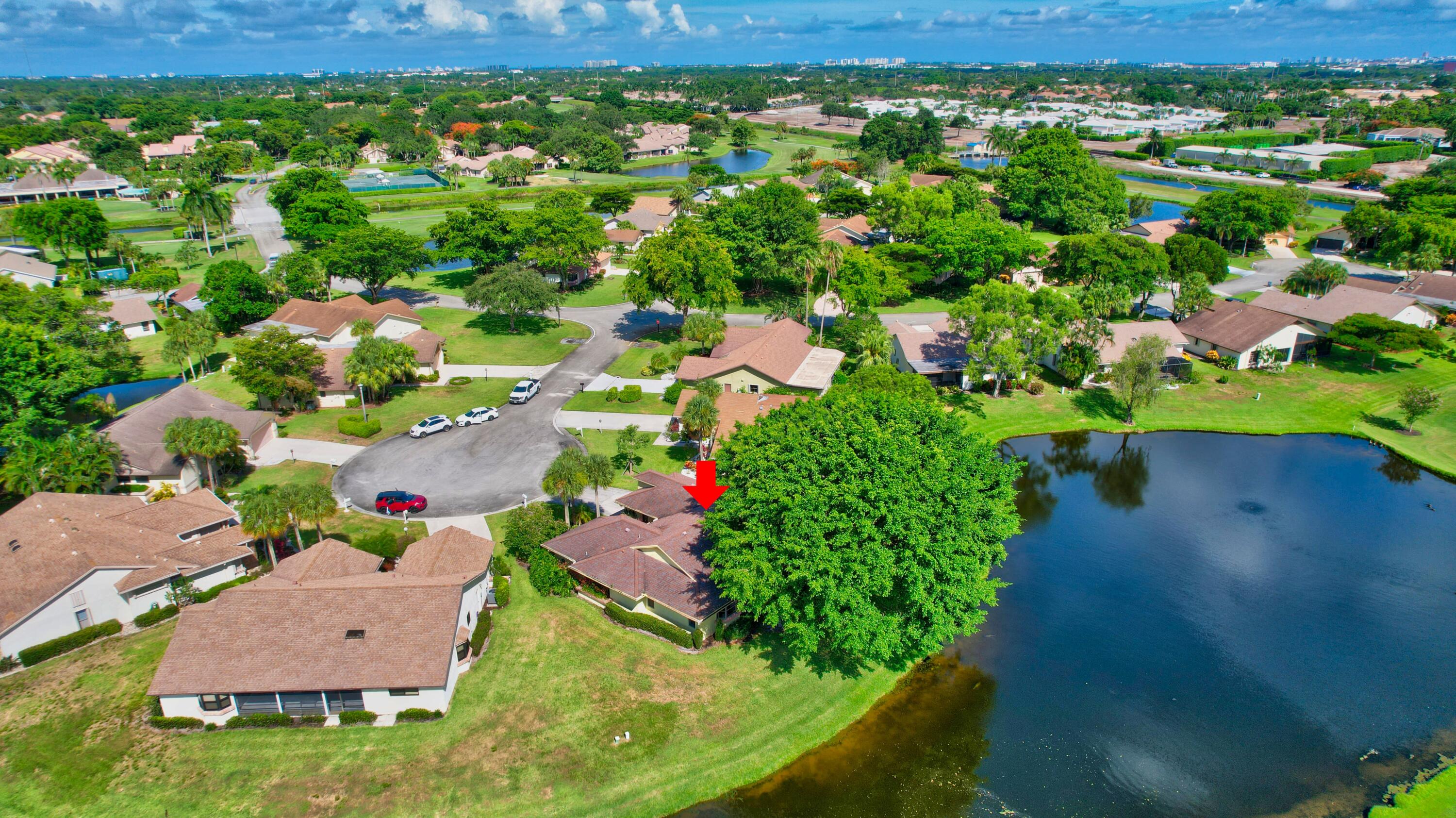 5642 Forest Oaks Terrace Delray Beach, FL 33484 - Photo 16 of 37 an aerial view of a house with a yard