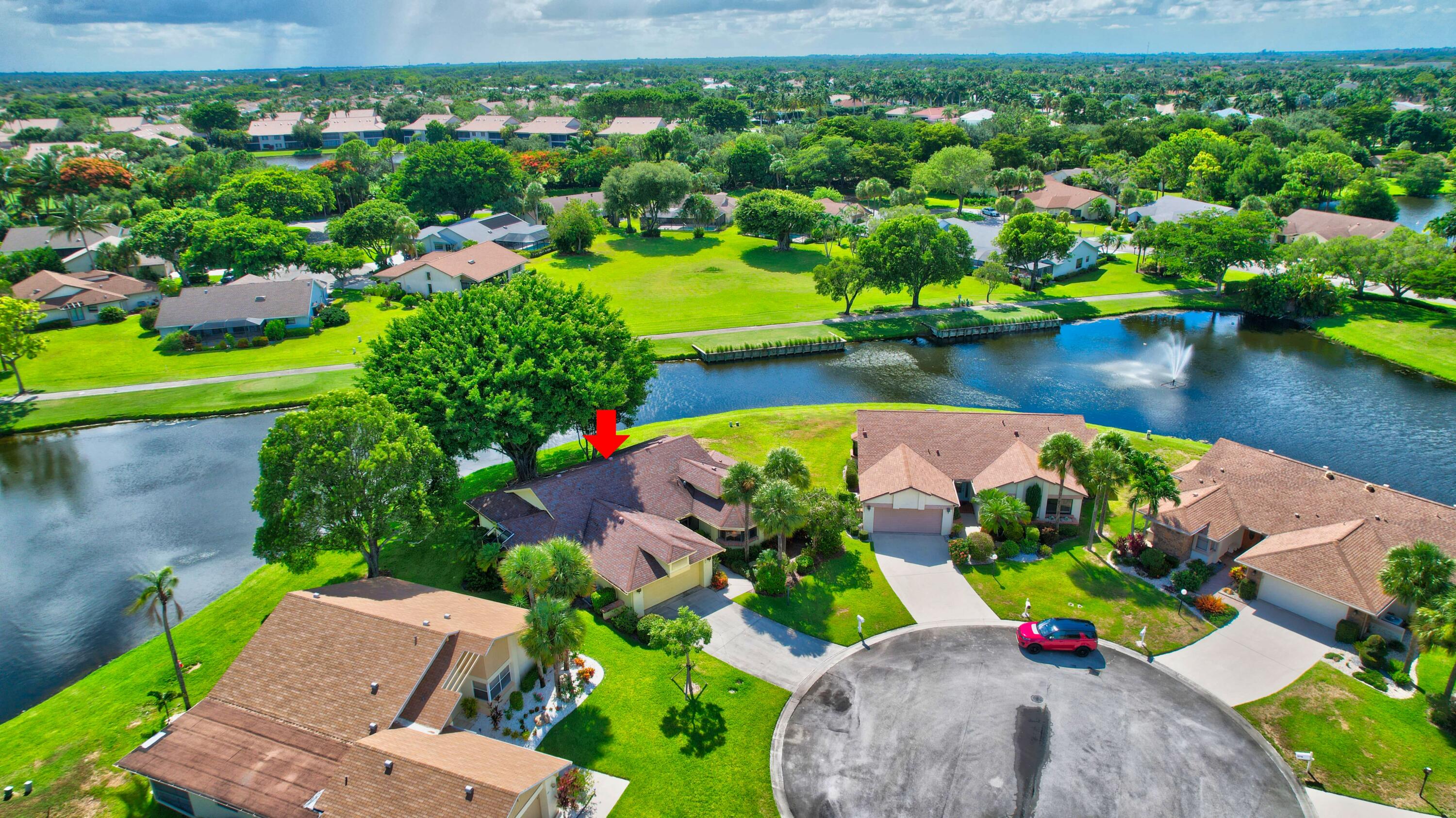 5642 Forest Oaks Terrace Delray Beach, FL 33484 - Photo 17 of 37 an aerial view of a house with a garden and lake view