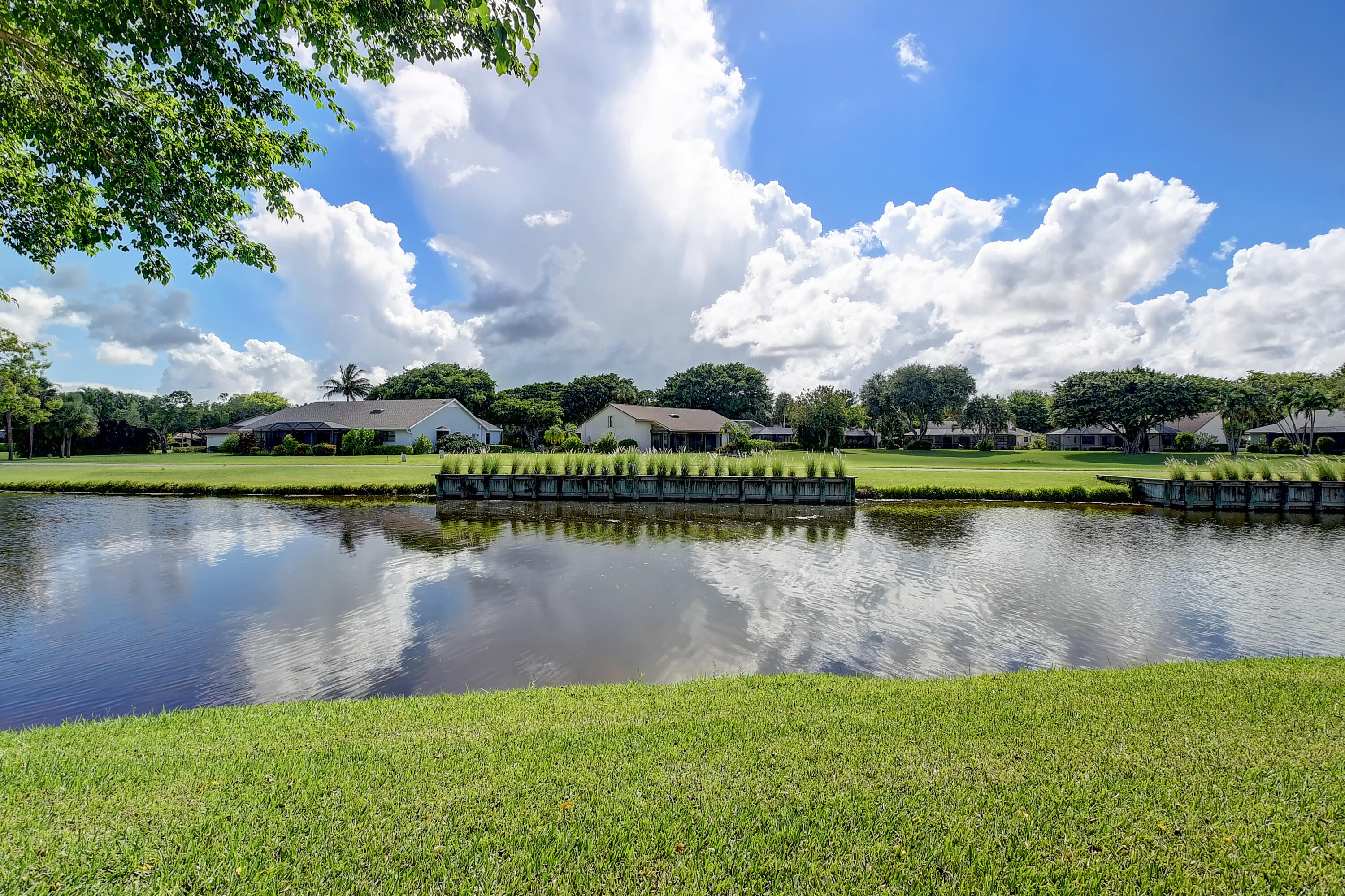 5642 Forest Oaks Terrace Delray Beach, FL 33484 - Photo 19 of 37 a view of a lake