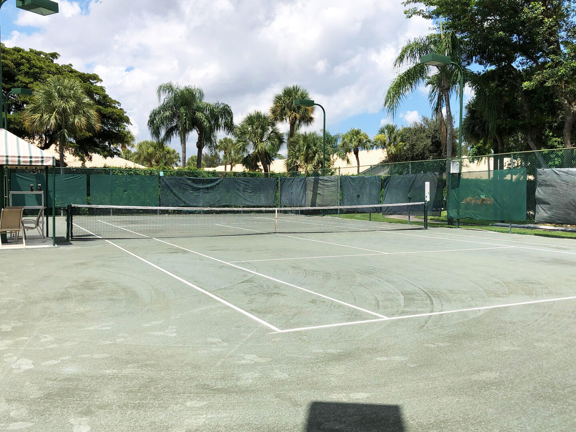 5642 Forest Oaks Terrace Delray Beach, FL 33484 - Photo 28 of 37 a view of a tennis court