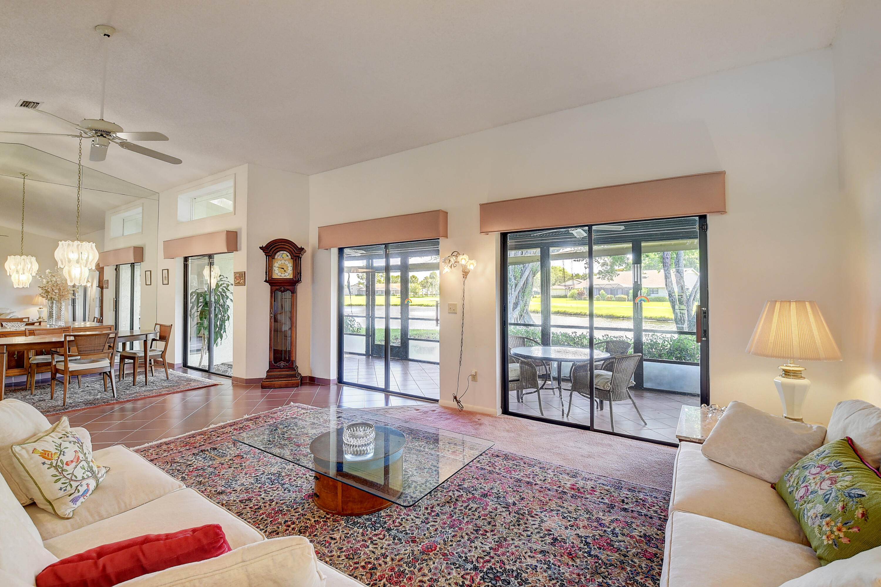 5642 Forest Oaks Terrace Delray Beach, FL 33484 - Photo 3 of 37 a living room with furniture and a window