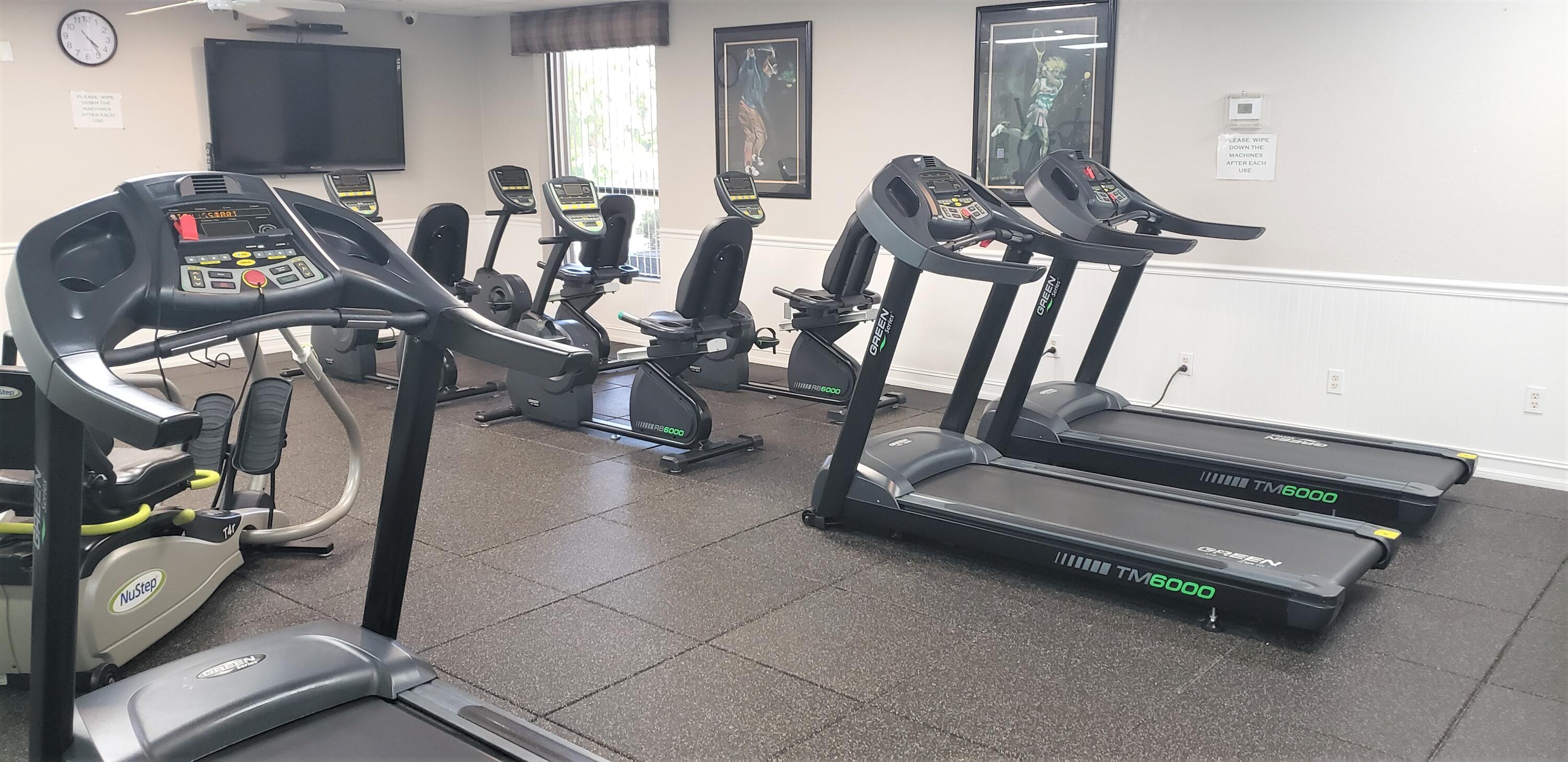 5642 Forest Oaks Terrace Delray Beach, FL 33484 - Photo 33 of 37 a view of a room with gym equipment