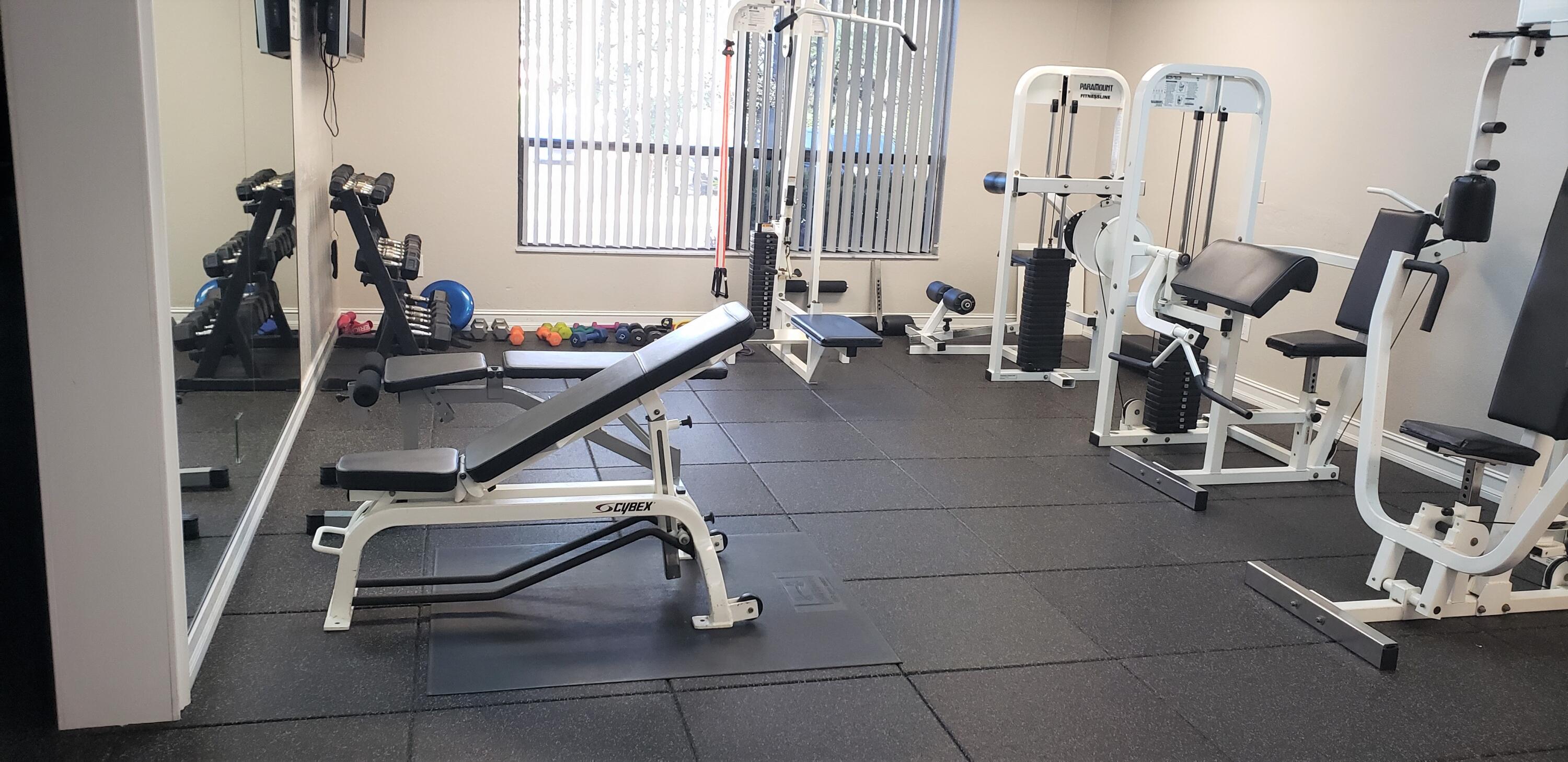 5642 Forest Oaks Terrace Delray Beach, FL 33484 - Photo 34 of 37 a room with gym equipment